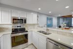 All stainless appliances, upgraded cabinets, and Corian counters